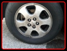 Dirty wheel not yet detailed by Fifty Dollar Detail, Ridgefield, WA.